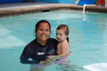 A woman and child in the pool